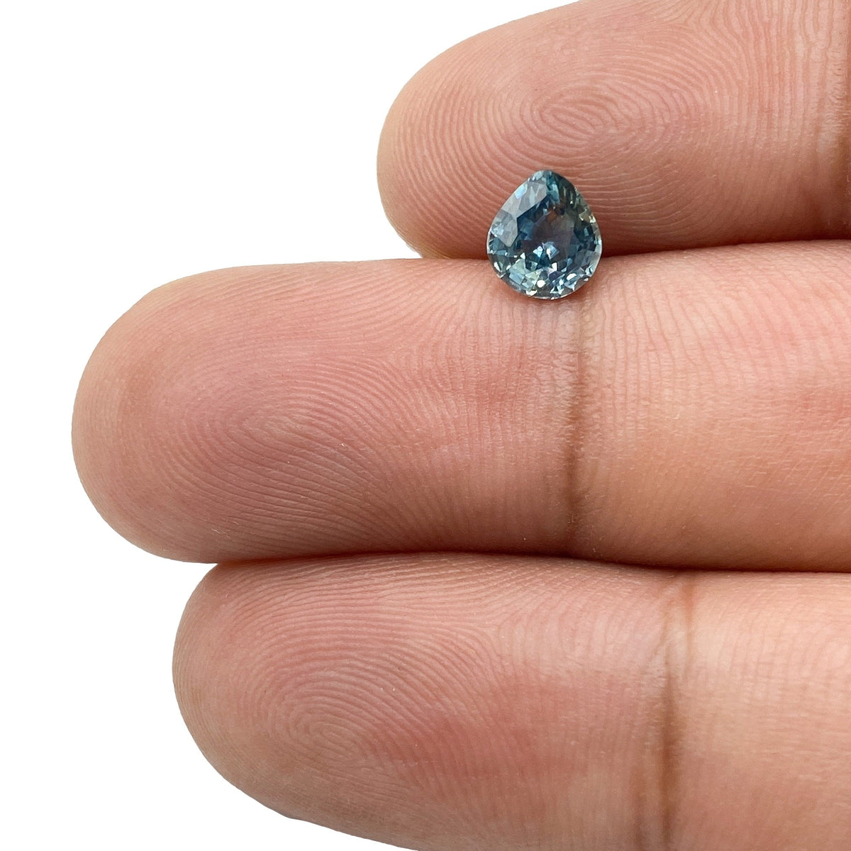 0.98ct | Brilliant Cut Pear Shape Blue Montana Sapphire-Modern Rustic Diamond